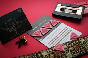 Close-up of guitar picks, cassette, - Credits: pexels
