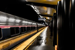 A sleek train parked at - Credits: pexels