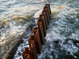 Rusty corrugated metal sea barriers - Credits: pexels