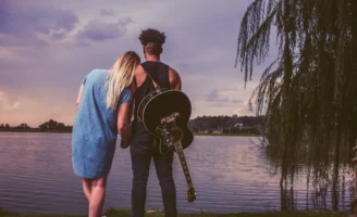 A couple embracing by a - Credits: pexels
