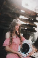 A woman in a pink - Credits: pexels