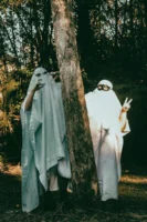 Two people in ghost costumes - Credits: pexels