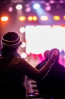 A person raises hand in - Credits: pexels