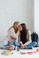 Two teenage girls sharing a - Credits: pexels