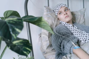 Young woman in hospital bed - Credits: pexels