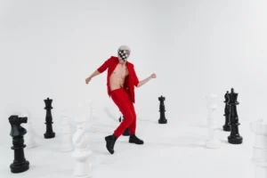 Person in red suit dances - Credits: pexels