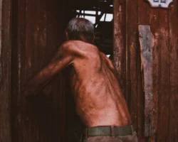 A shirtless elderly man with - Credits: pexels