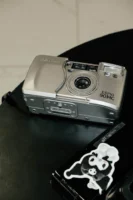 A silver vintage film camera - Credits: pexels