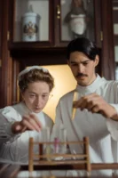 Two pharmacists in historical attire - Credits: pexels