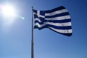 Greece's national flag waving against - Credits: pexels