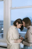 Two women share a comforting - Credits: pexels