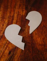 Cardboard broken heart symbol on - Credits: pexels