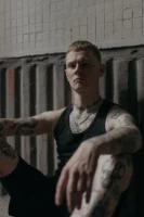 A tattooed man in a - Credits: pexels