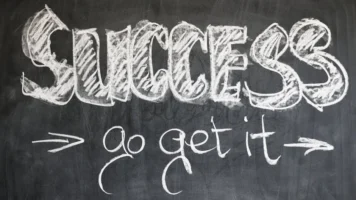 Motivational chalkboard with 'Success - - Credits: pexels