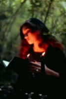 A woman reading a book - Credits: pexels