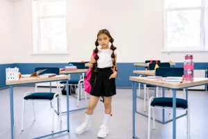 A young girl stands confidently - Credits: pexels