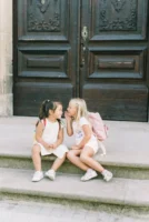 Two young girls with backpacks - Credits: pexels