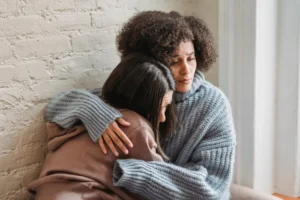 Two friends share an emotional - Credits: pexels