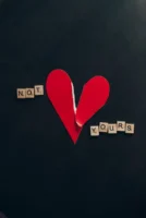 A torn red heart with - Credits: pexels