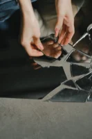 Close-up of hands touching reflective - Credits: pexels