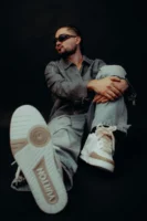 Model sitting in studio showcasing - Credits: pexels