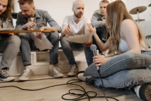 Band members engaged in a - Credits: pexels