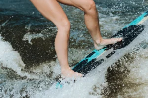 Close-up of a surfer skillfully - Credits: pexels