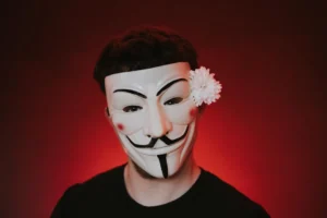 Unrecognizable rebel in anonymous mask - Credits: pexels