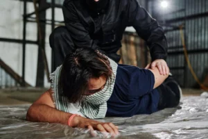 Masked officer arrests man in - Credits: pexels