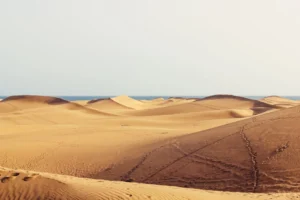 Vast desert landscape with rolling - Credits: pexels