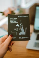 A hand holding a card - Credits: pexels