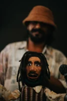 Handcrafted puppet with dreadlocks in - Credits: pexels
