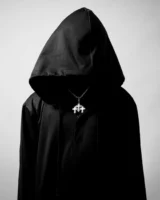 A hooded figure in a - Credits: pexels