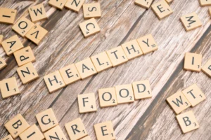 Wooden tiles spelling 'healthy food' - Credits: pexels