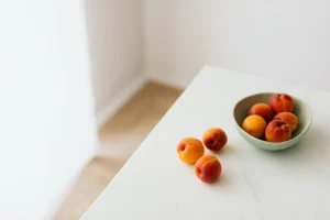 Fresh apricots in a minimalist - Credits: pexels