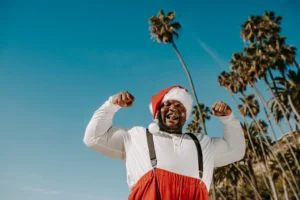 A joyful Santa Claus in - Credits: pexels