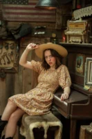 Woman in floral dress and - Credits: pexels