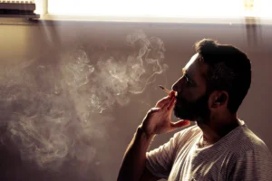 A man smoking a cigarette - Credits: pexels