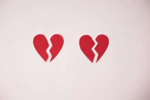 Two red broken heart shapes - Credits: pexels