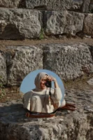 A woman takes a photo - Credits: pexels