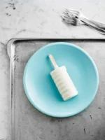 A white popsicle on a - Credits: pexels
