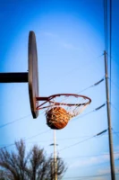 A basketball perfectly swishes through - Credits: pexels