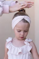 A mother styles her daughter's - Credits: pexels