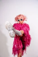 Stylish woman poses in pink - Credits: pexels