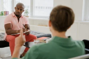 Therapist and client engaged in - Credits: pexels