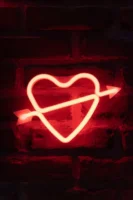 Bright neon heart with arrow - Credits: pexels