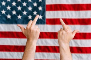 Hands displaying a rebellious gesture - Credits: pexels