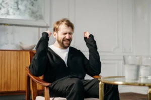 A bearded man expressing emotional - Credits: pexels
