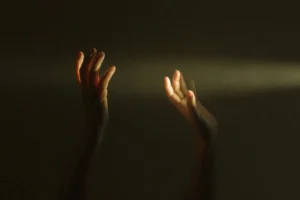 Expressive hands reaching towards a - Credits: pexels