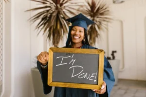 A proud graduate holds a - Credits: pexels